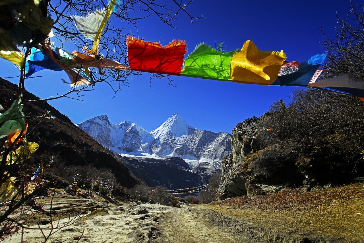 old prayer flags in the wind mountains