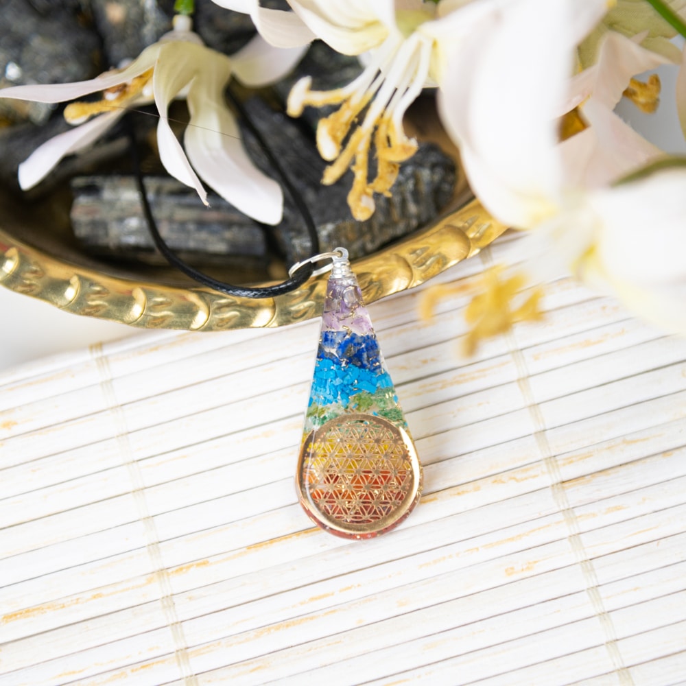 orgonite rainbow pendant with flower of life symbol