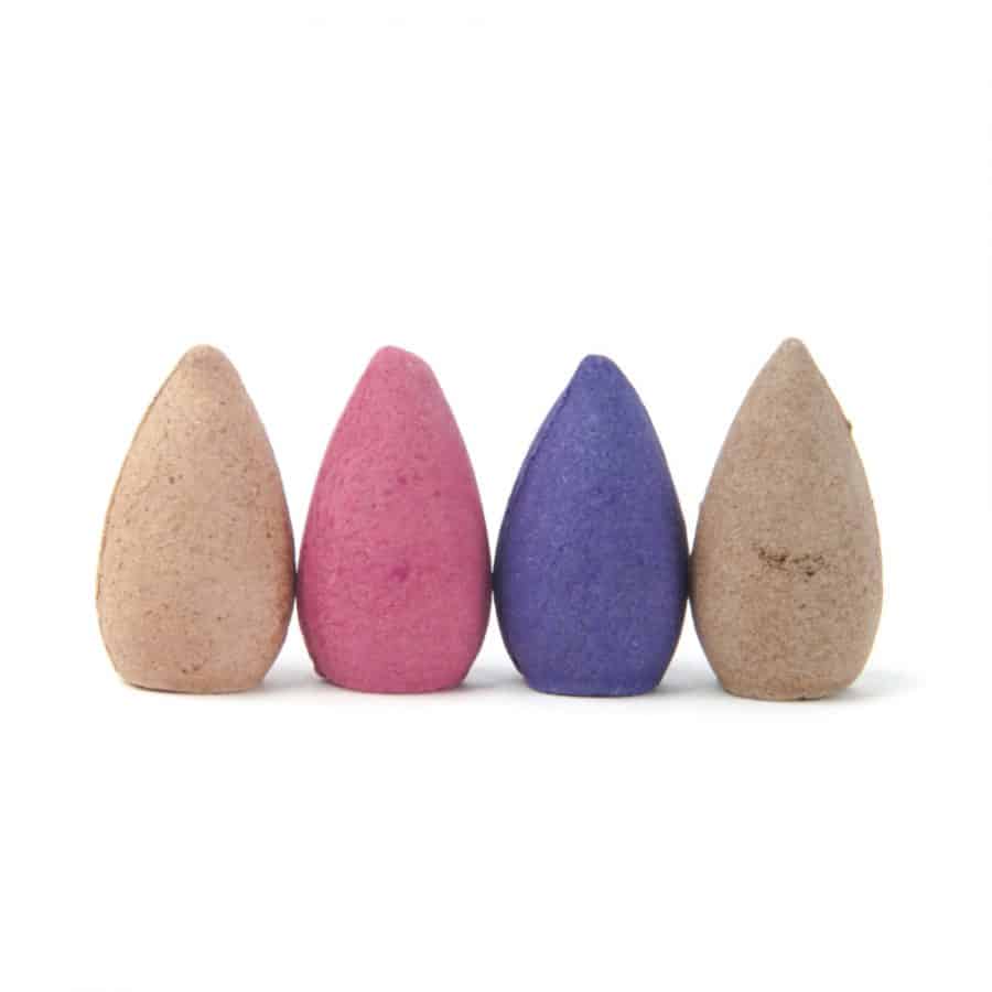 four backflow incense cones in a row