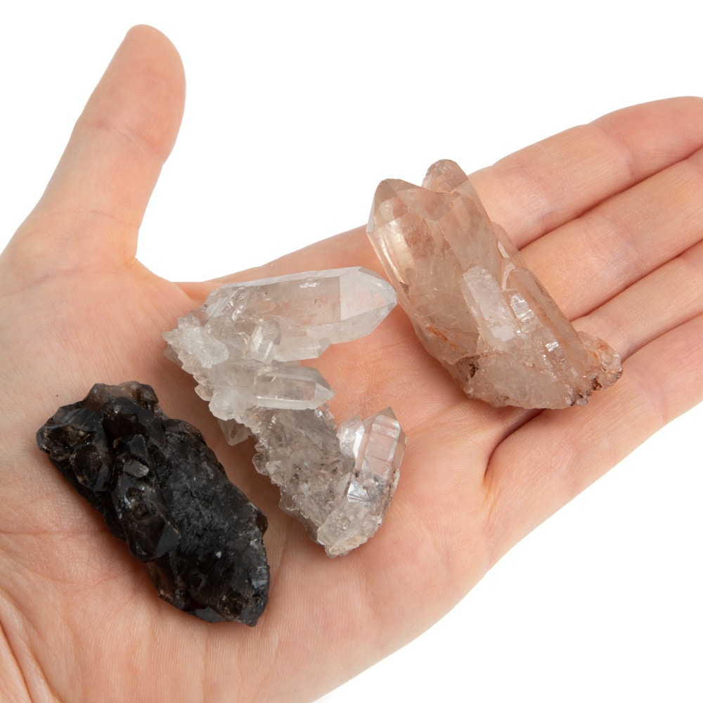 raw gemstones quartz in hand