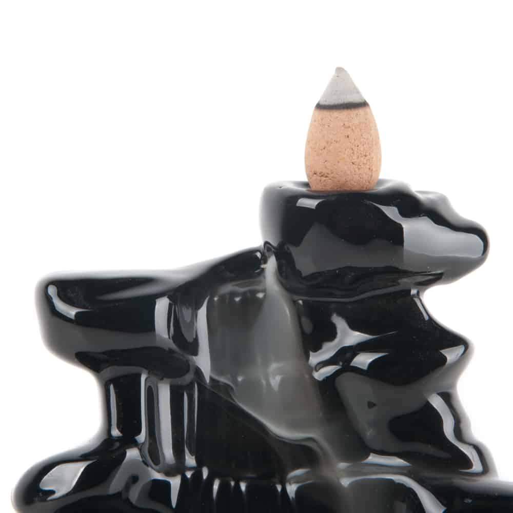 backflow incense burner close up incense cone