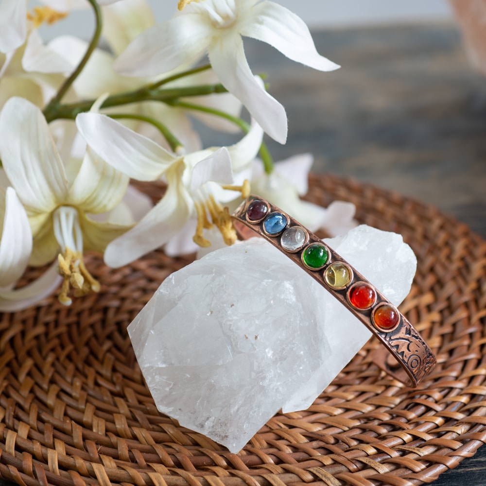 chakra gemstone copper bracelet on rock crystal