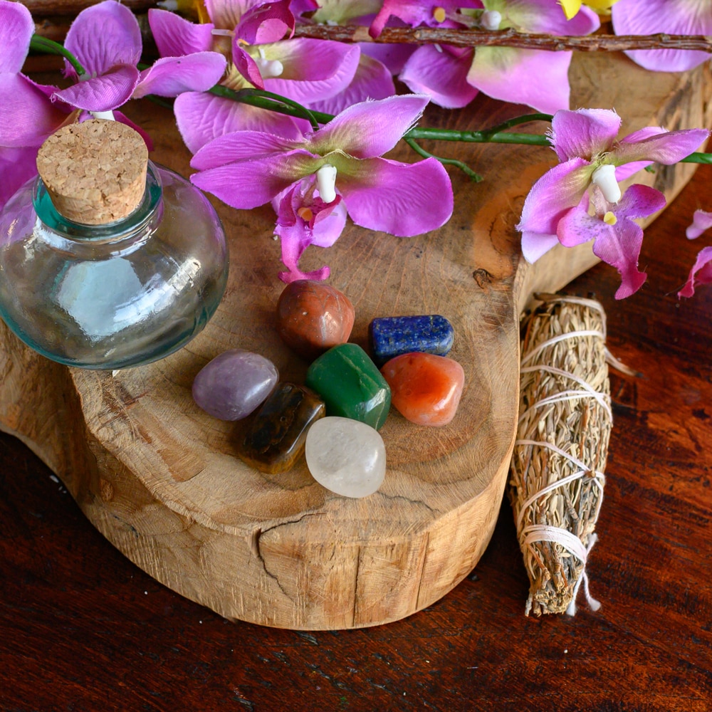 chakra tumbled gemstones with water bottle