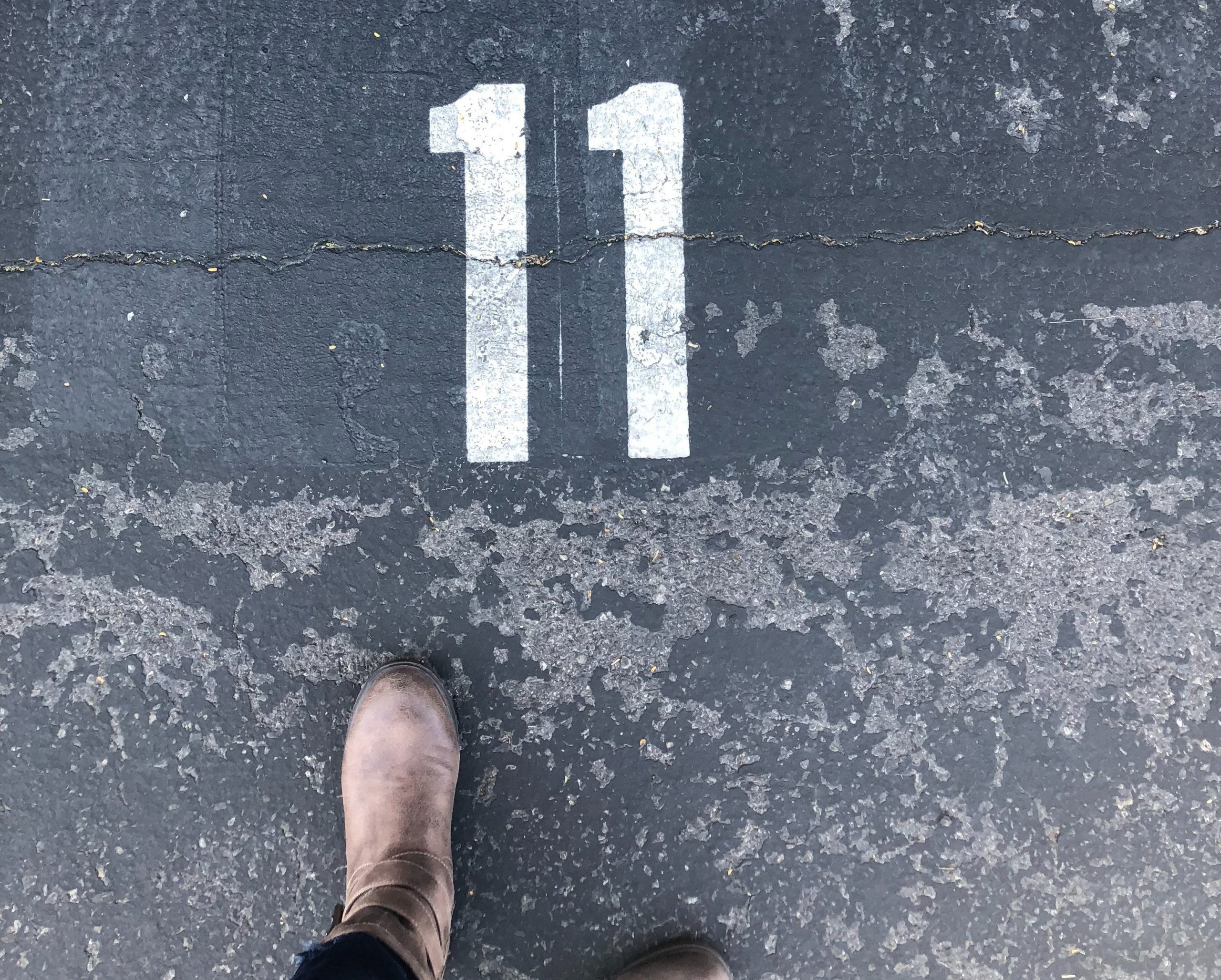 master number 11 on pavement