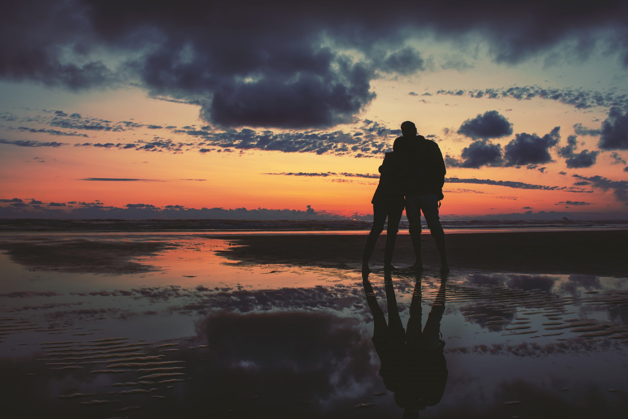 lovers on beach sunset