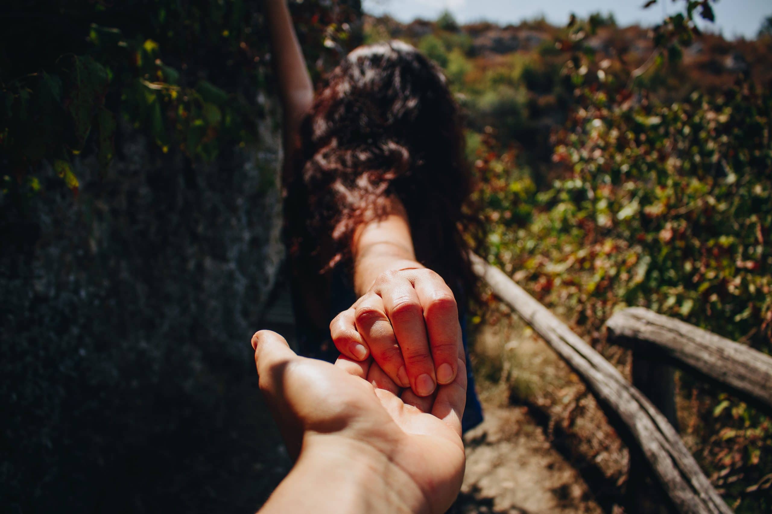 holding hands outside trees