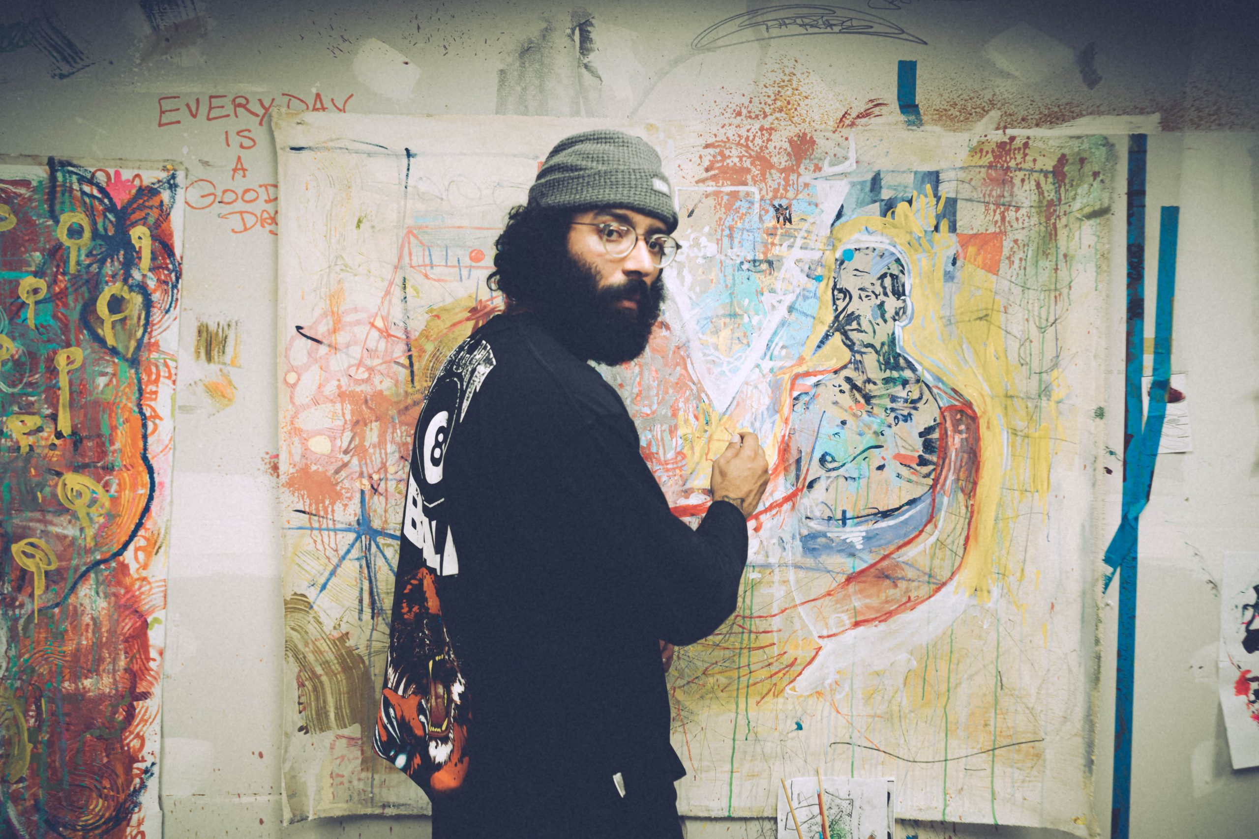 man with beard painting