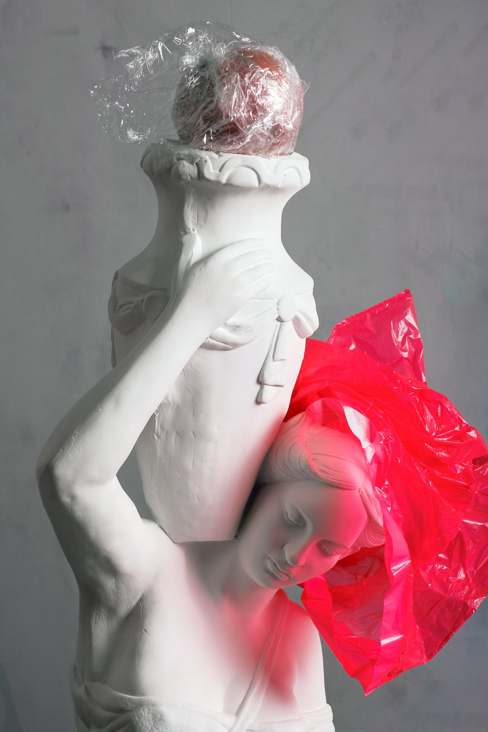 white plaster statue Aquarius with pink