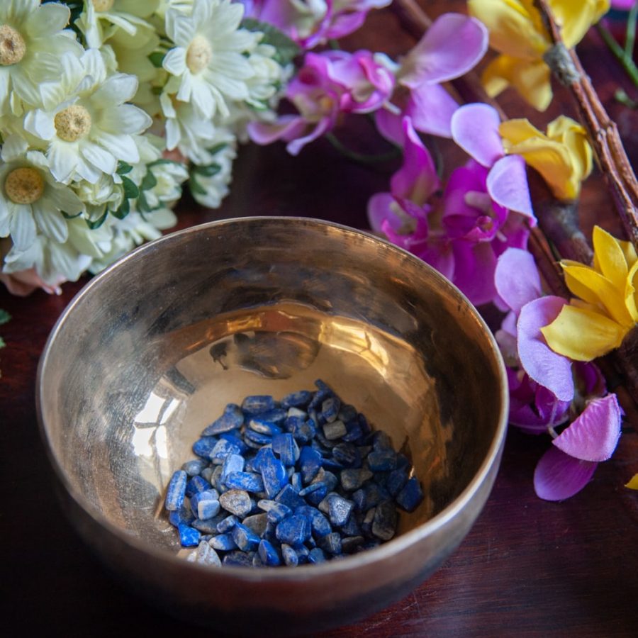 singing bowl full of lapis lazuli tumbled stones