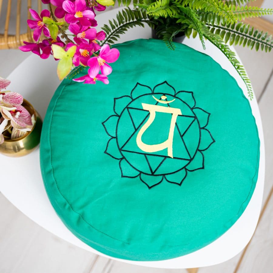 green spiru round meditation cushion on chair
