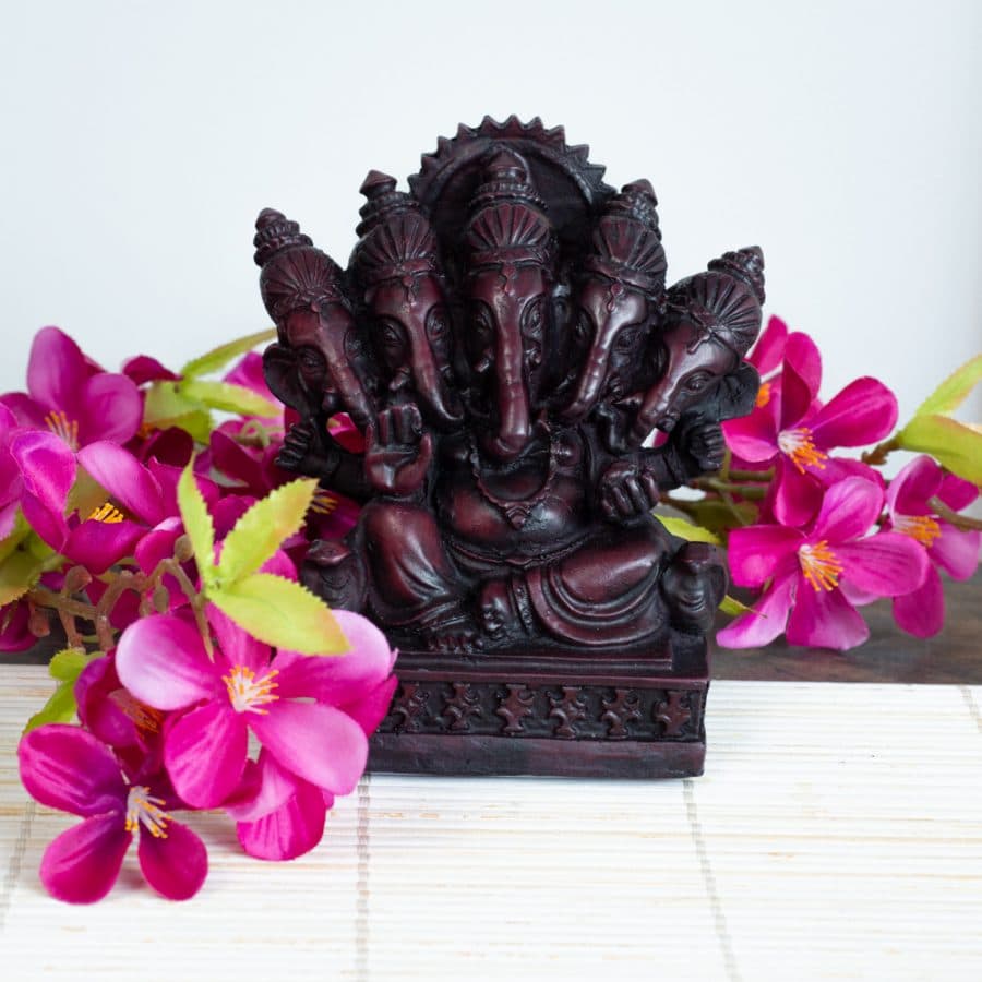 hindu genesha statue mudra meditation with flowers