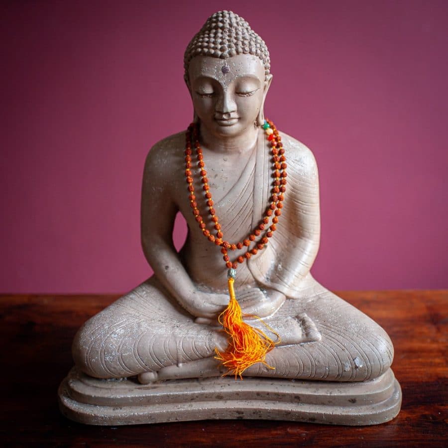 buddha statue with rudraksha mala