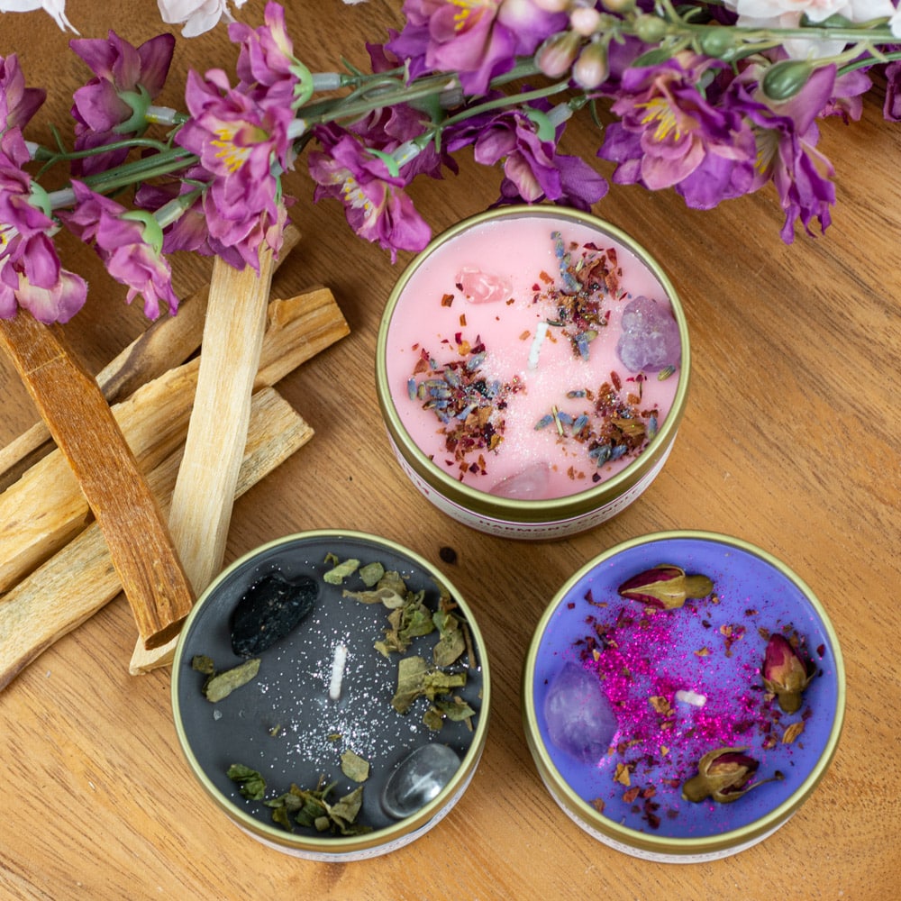 spiru spell candles with palo santo herbs and gemstones black pink purple
