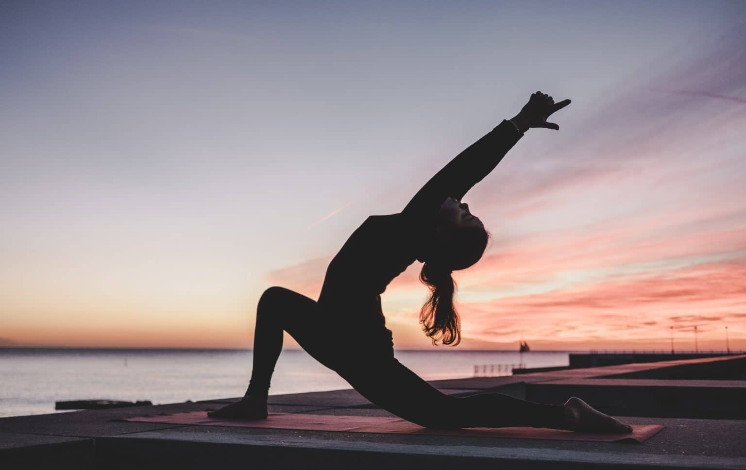 outdoor yoga sunset crescent lunge