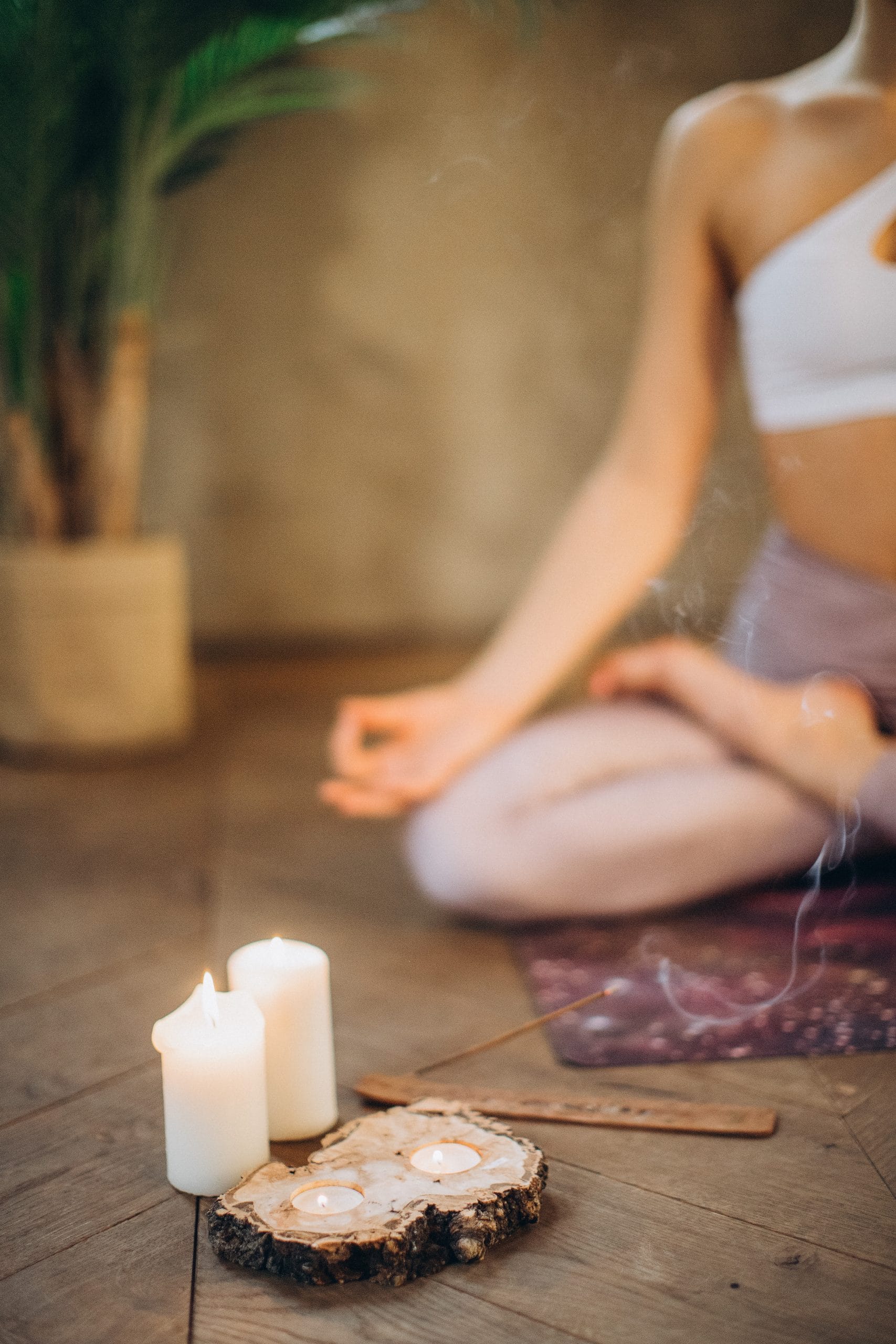 yoga mat meditation lotus pose candles and incense