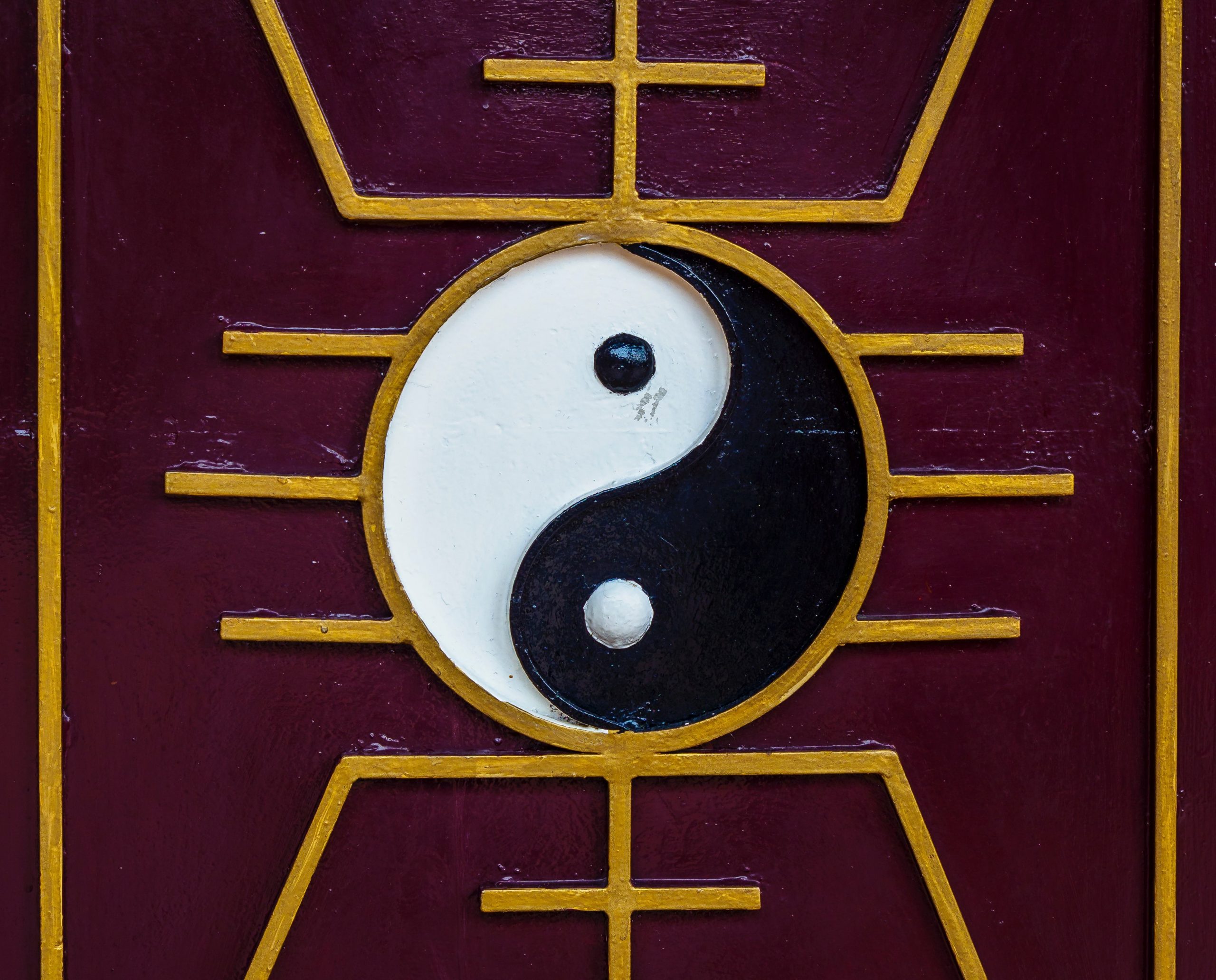 red gold door yin yang symbol black white