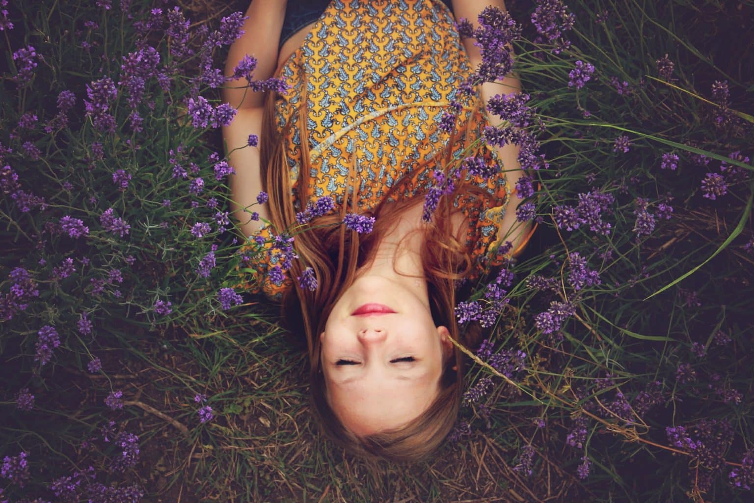 girl sleeping in flowers