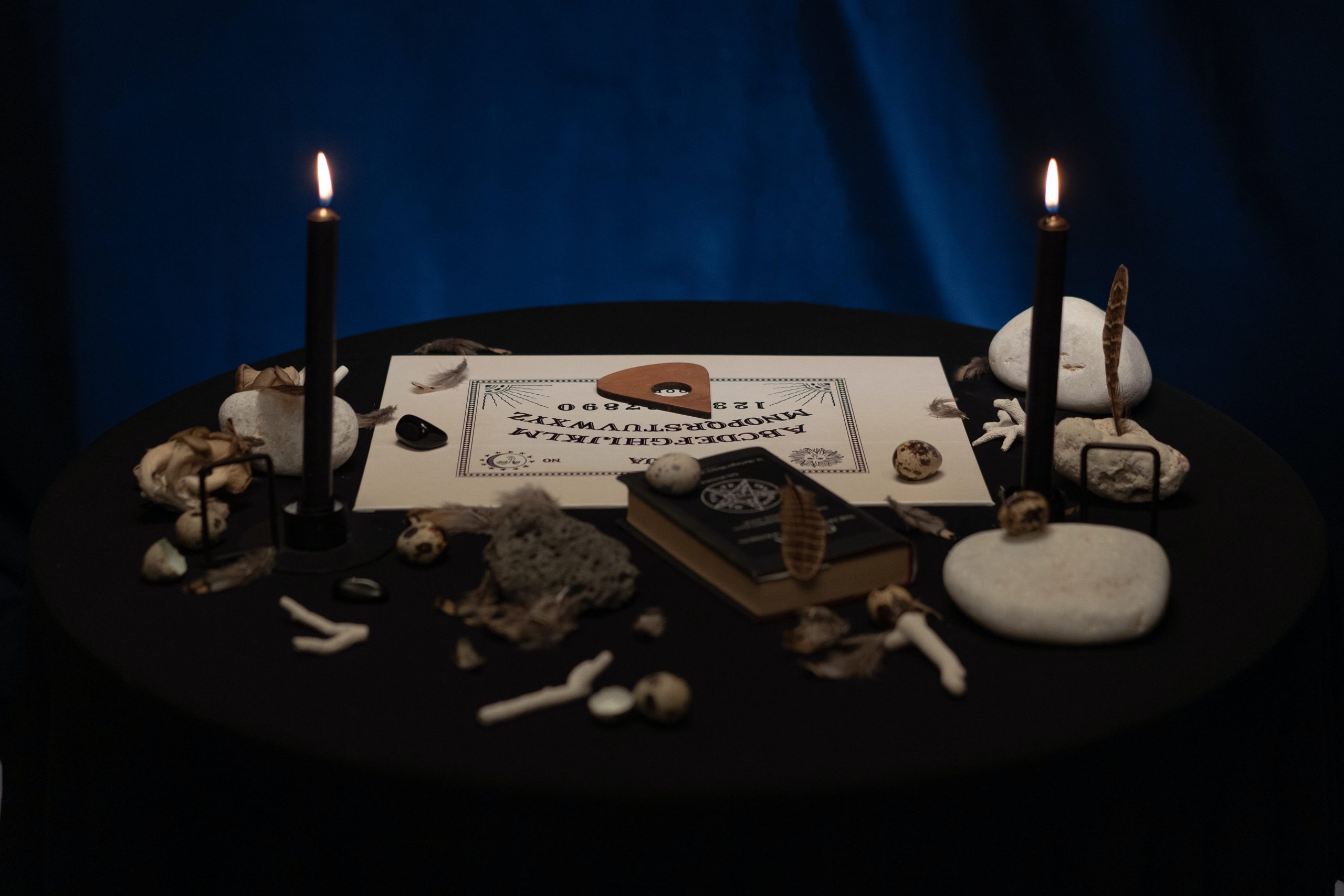wicca alter stones bones black magic book feathers candles ouija board