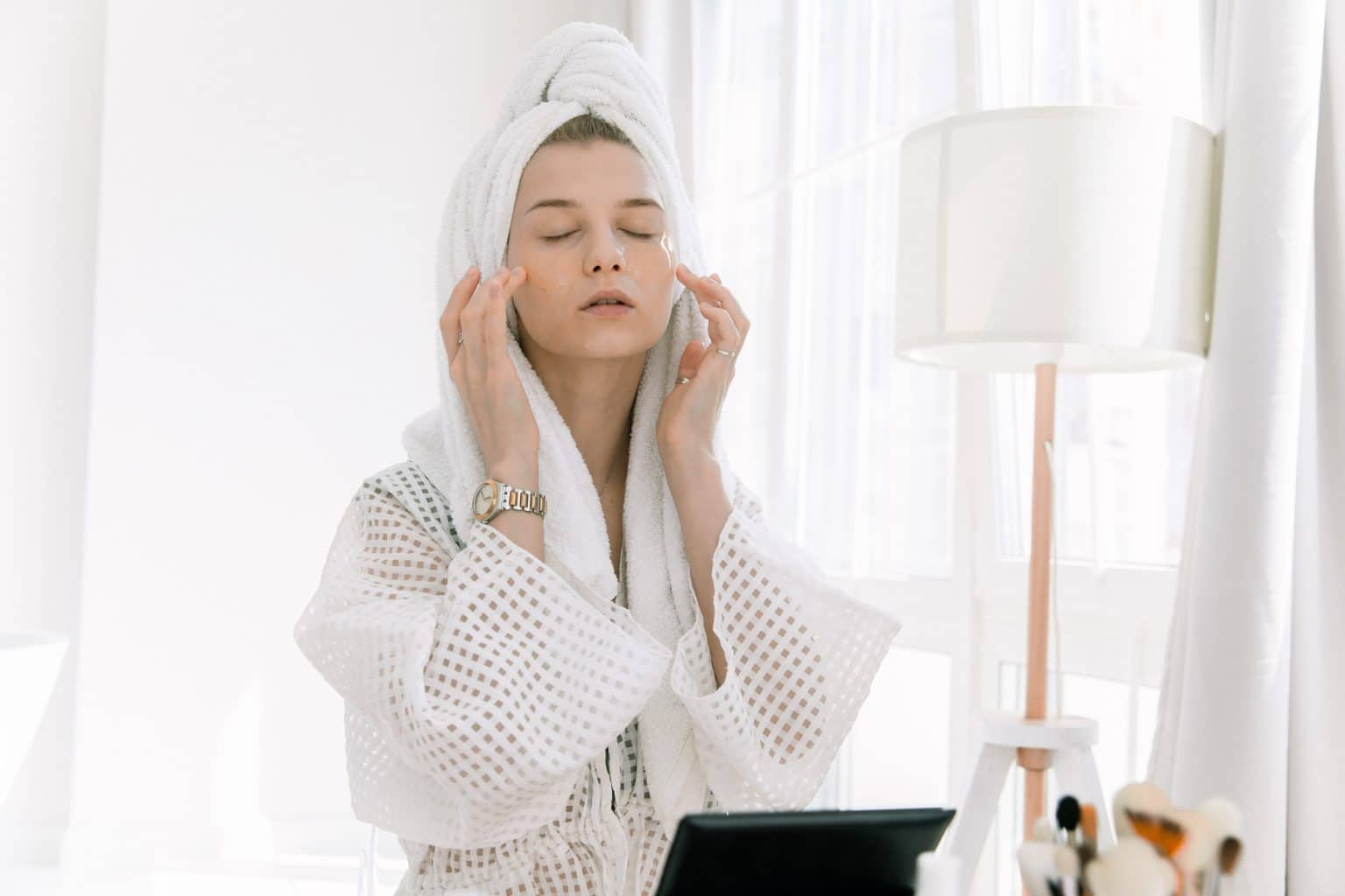 woman white bathrobe facial yoga massage 
