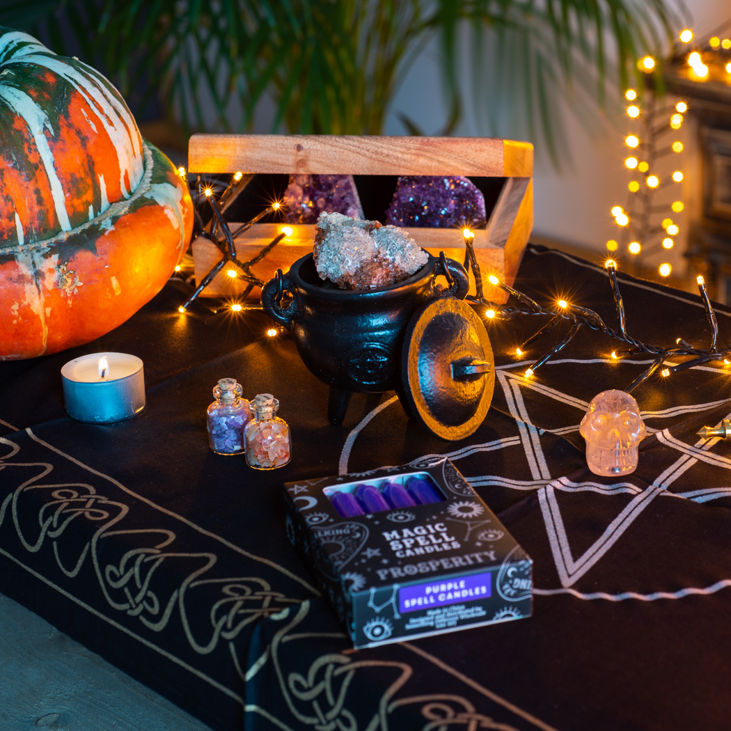 pumpkin tarot box wicca cauldrun spell candles altar cloth pentagram crystal skull with dim lights