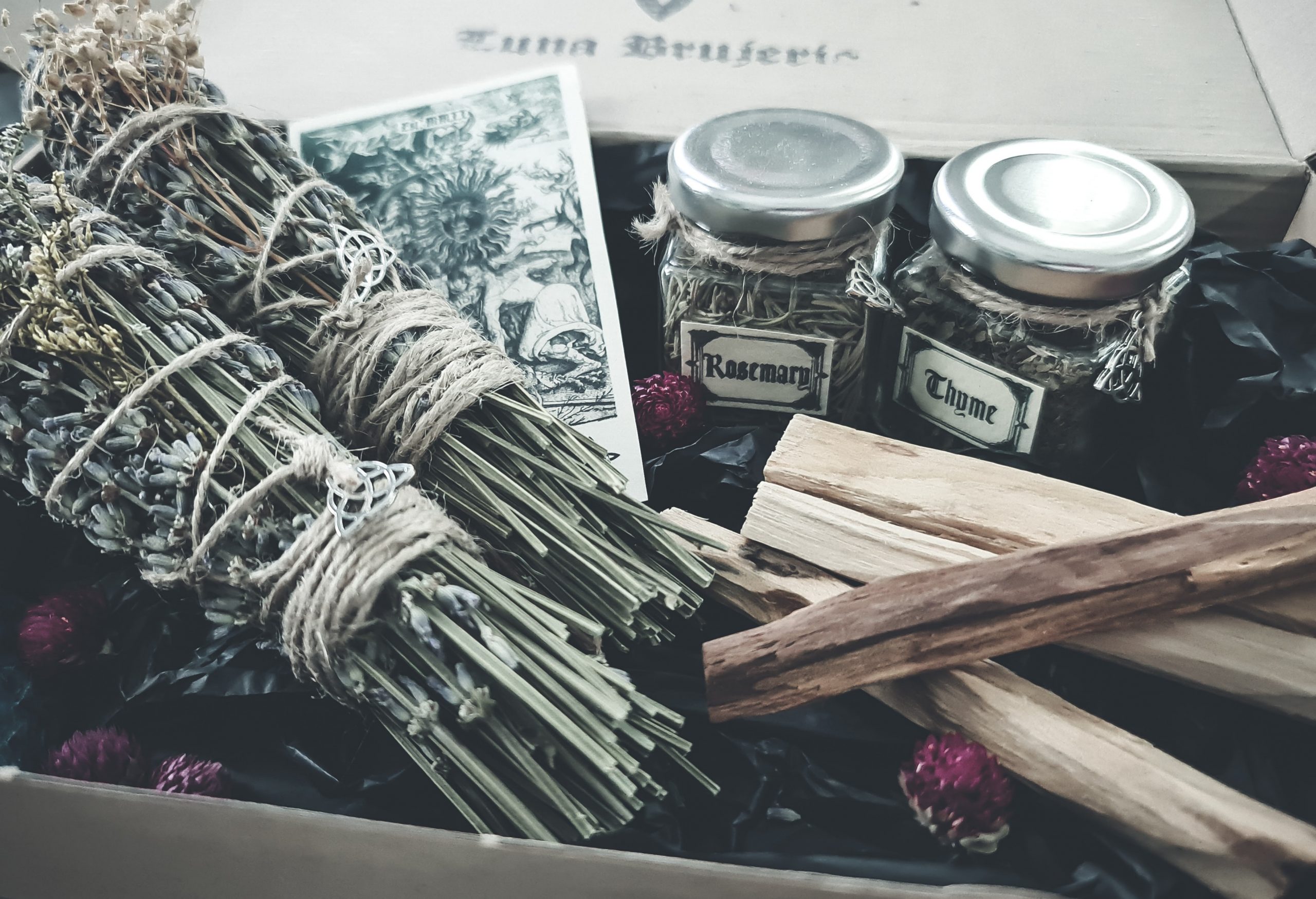 dried lavender and herb bundle smudge sticks palo santo pot of dried rosemary and thyme tarrot cards