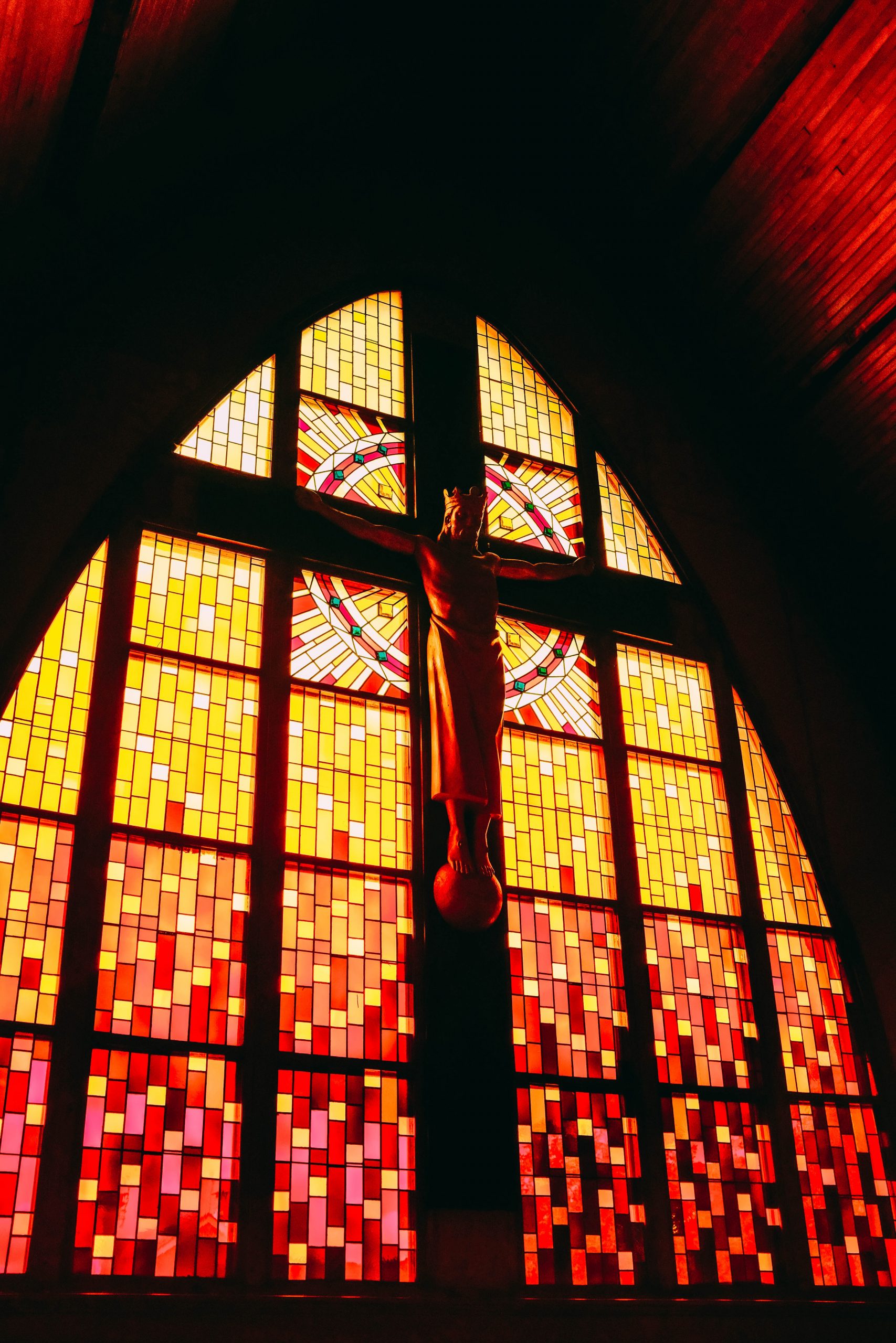 modern church interior crucifix and stained glass
