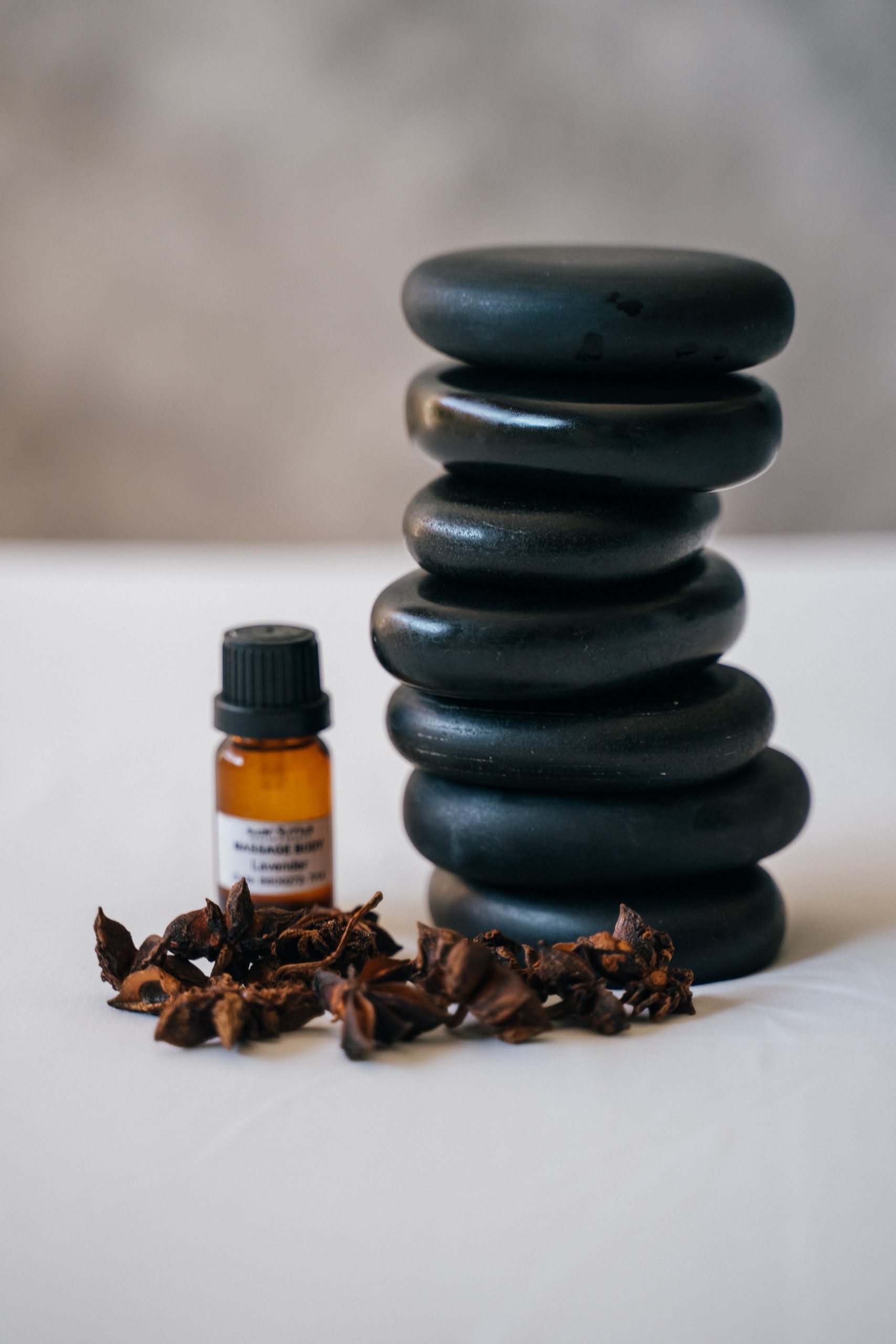stack massage basalt stones clove massage oil