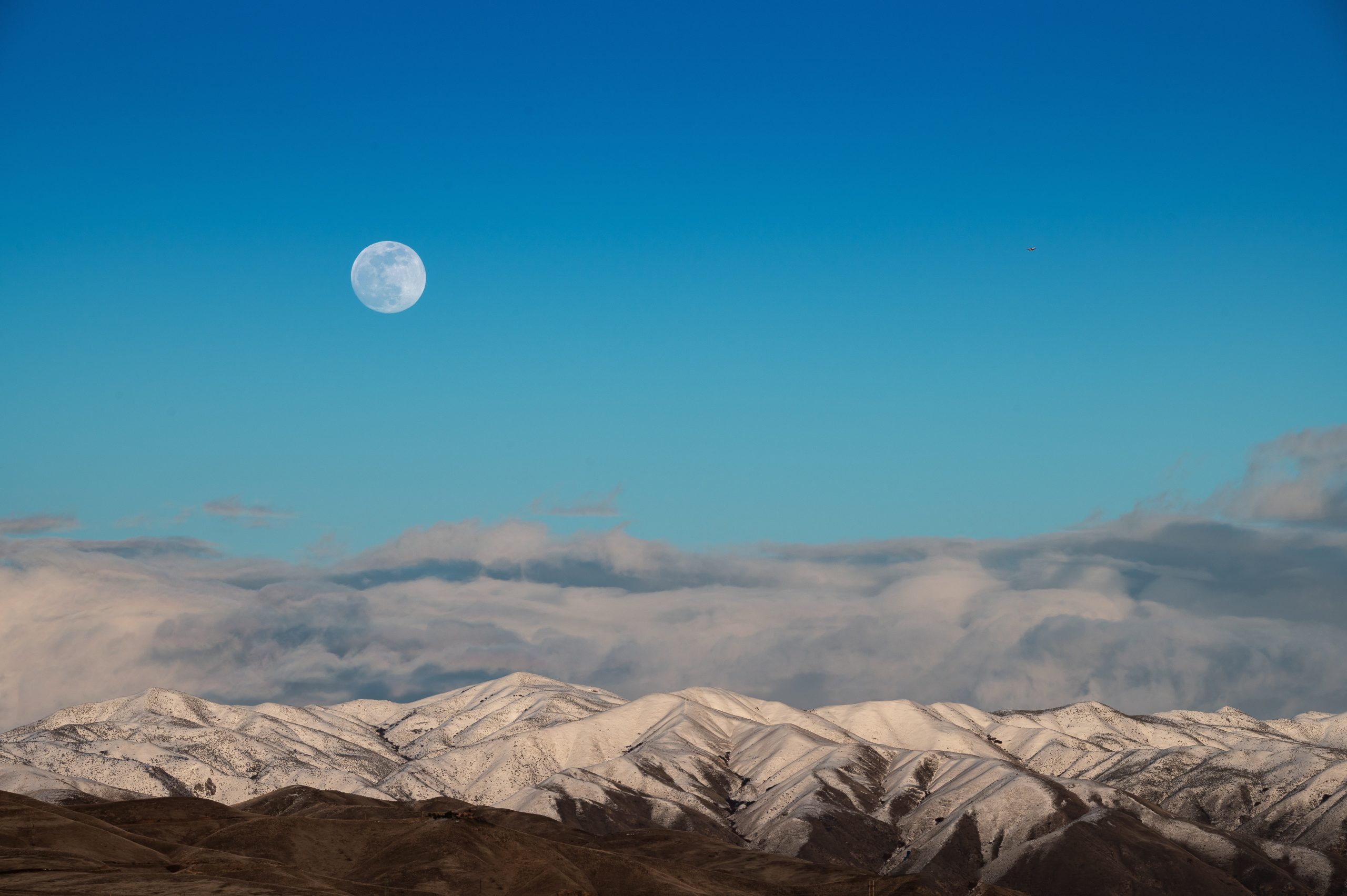 moon over snowy mountains