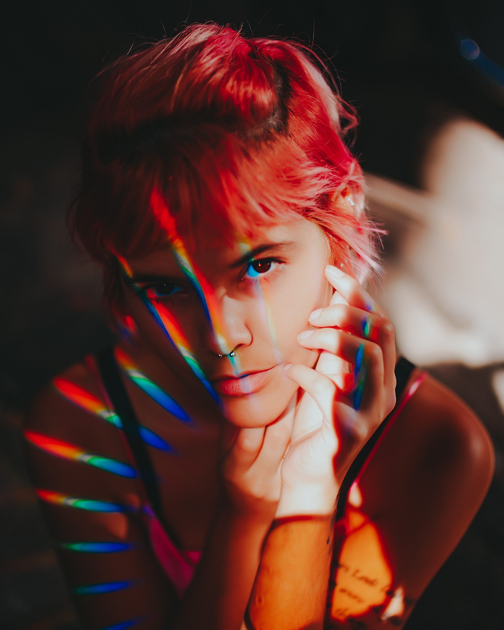 woman with aura prisma colors pink hair